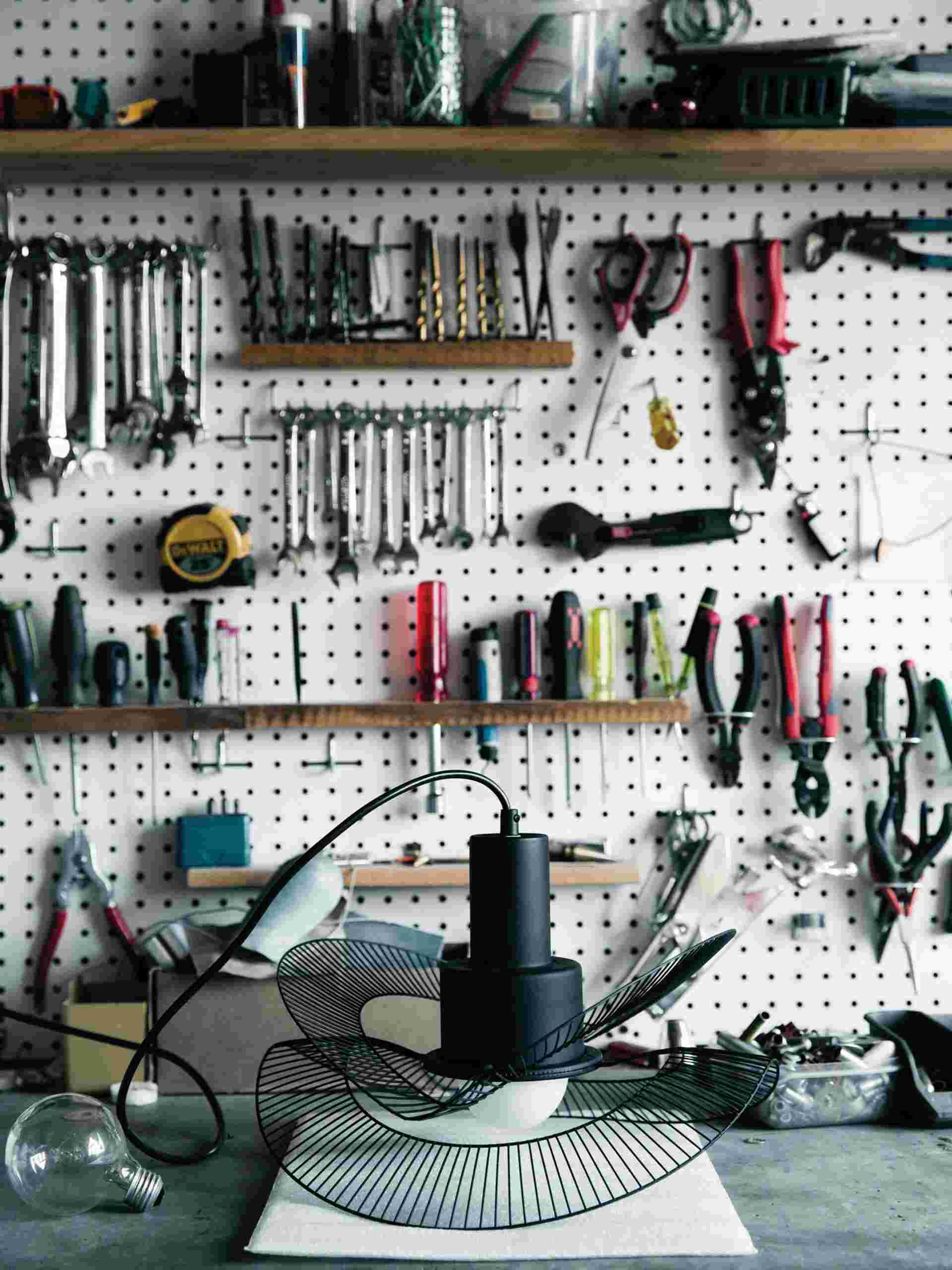 tools hanging on a pegboard