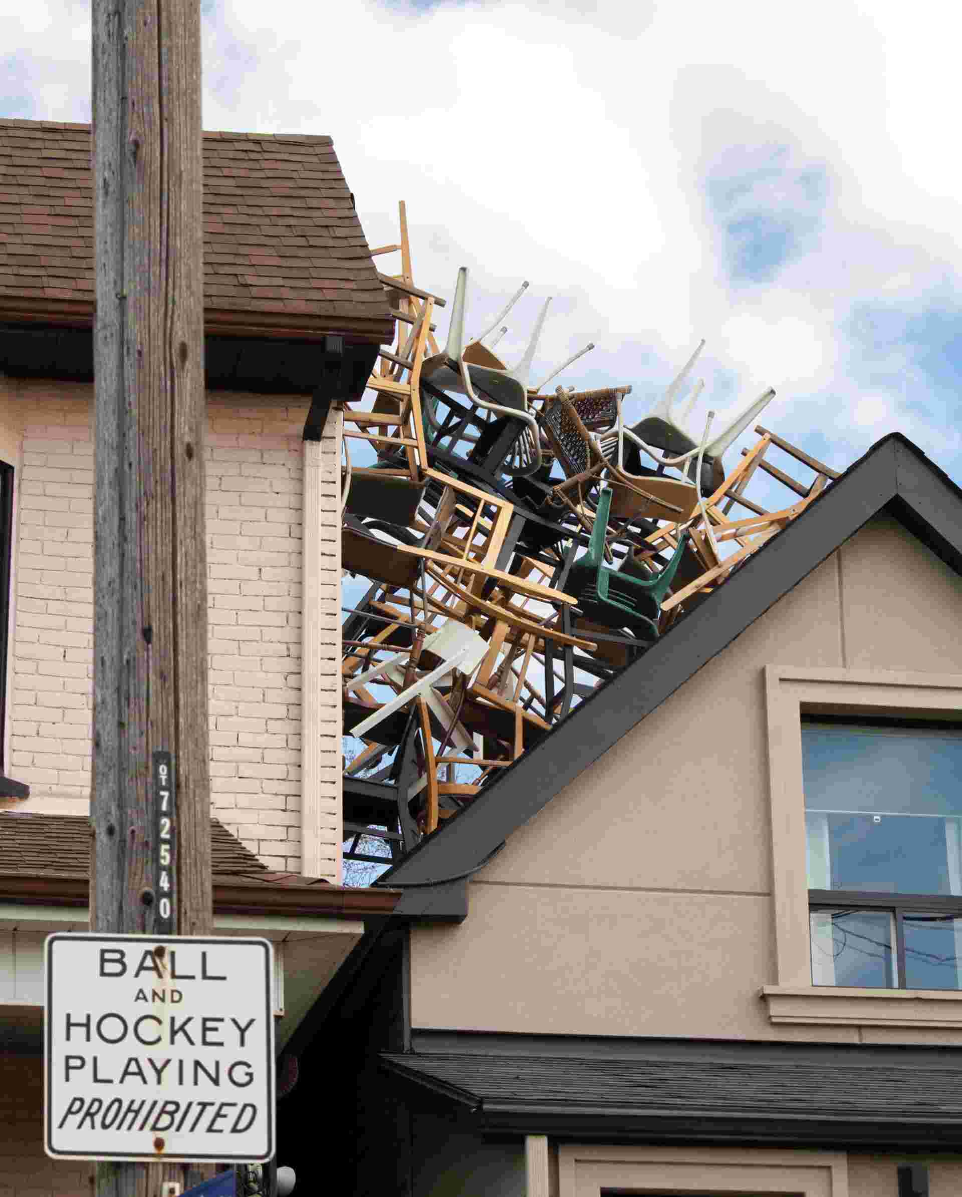 Eric Lachance - FeaturedImage_Photo-by-ERIC-LACHANCE-of-space-between-2-houses-filled-multiple-chair