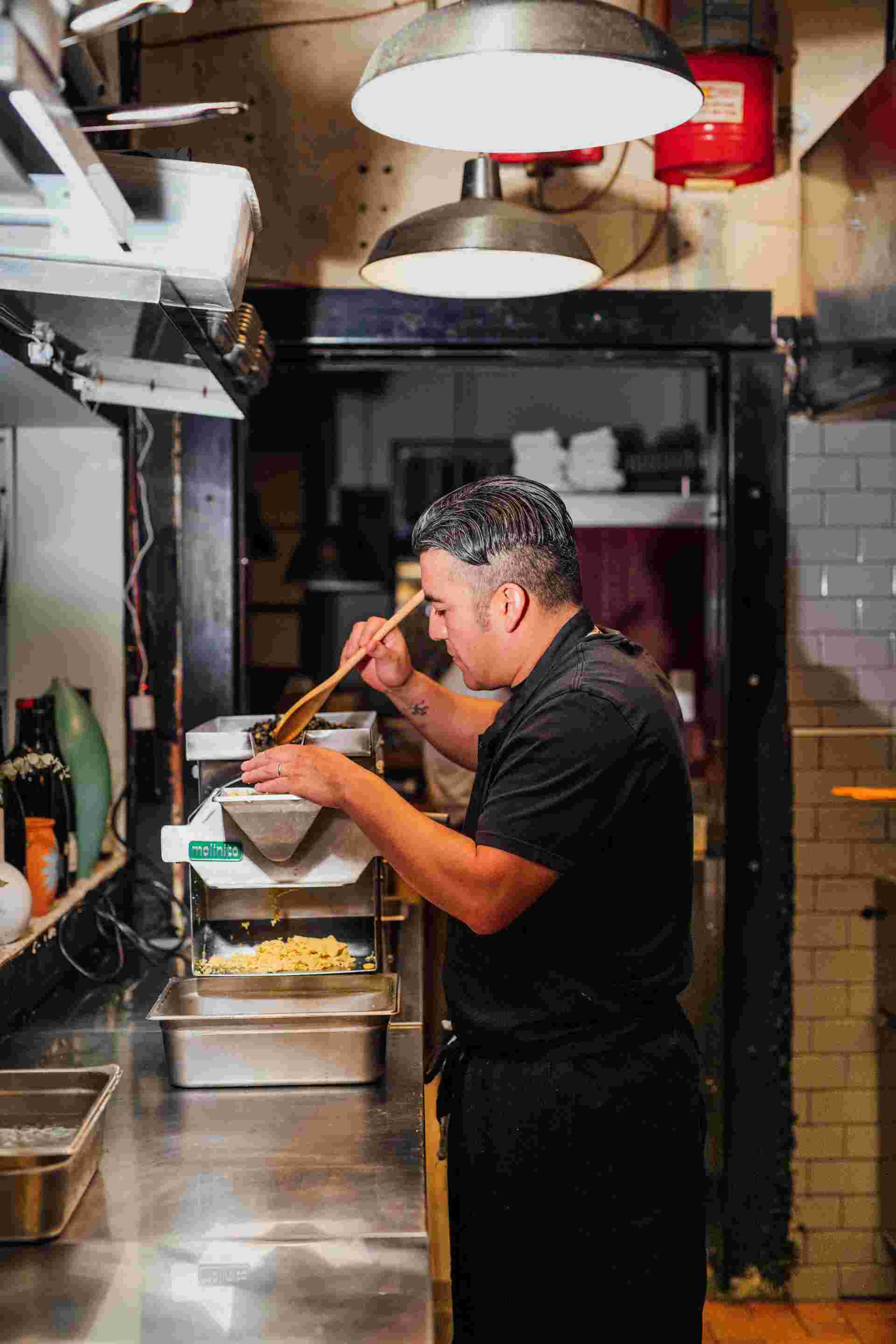 Family Meal - 18-Chef-working-with-a-pasta-machine-in-a-kitchen