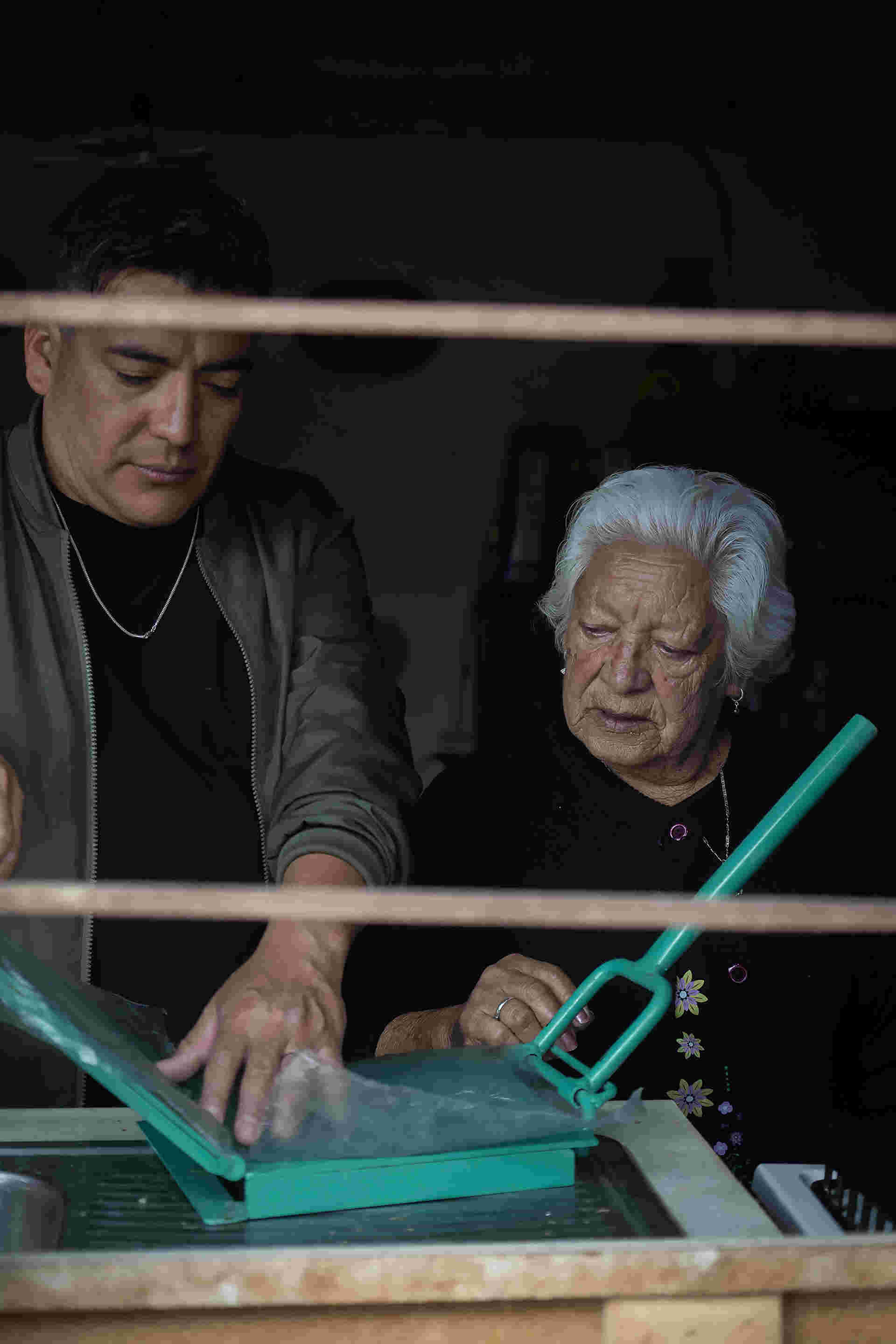 Family Meal - 20-man-and-elderly-woman-making-tortillas