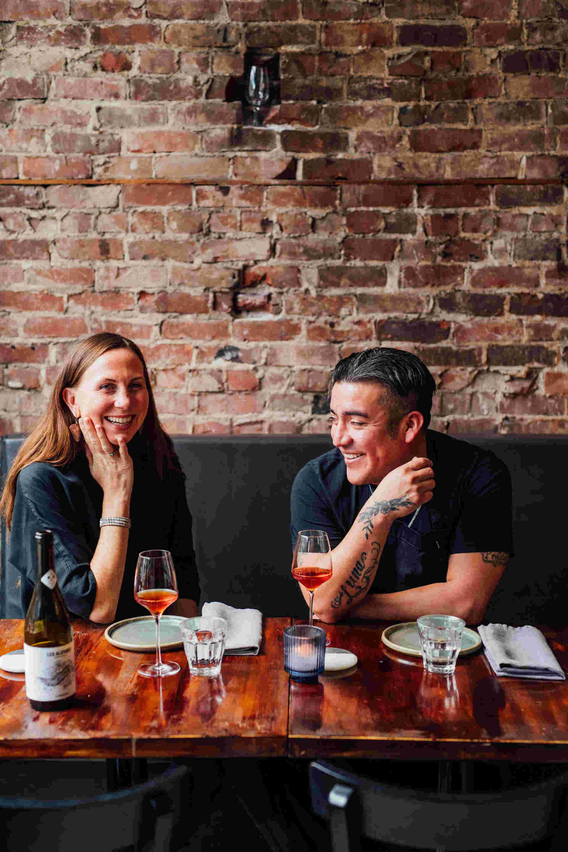 Family Meal - 21-Two-people-smiling-and-drinking-wine-at-a-restaurant-table
