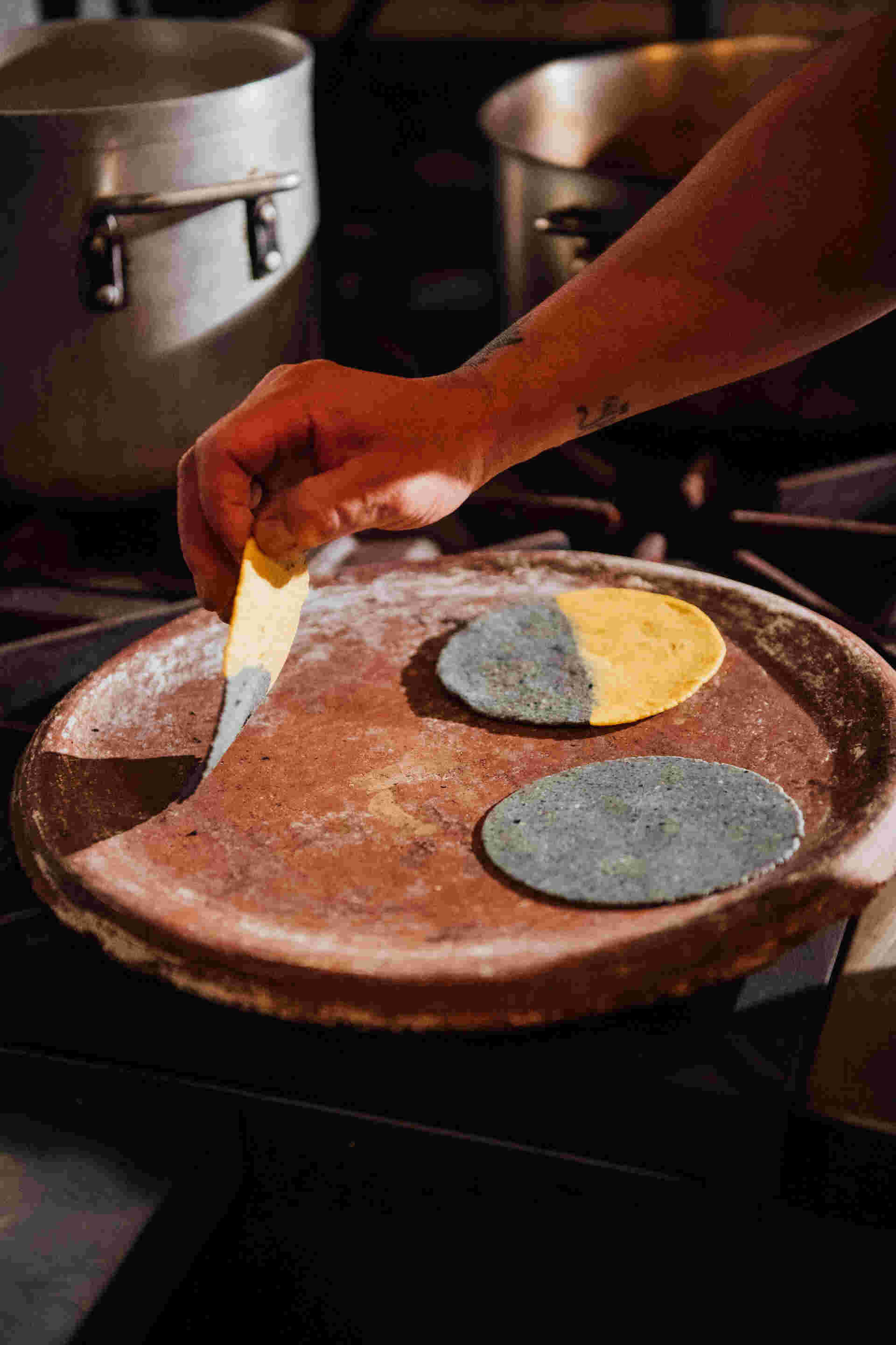 Family Meal - 23-Hand-placing-a-tortilla-on-a-hot-griddle