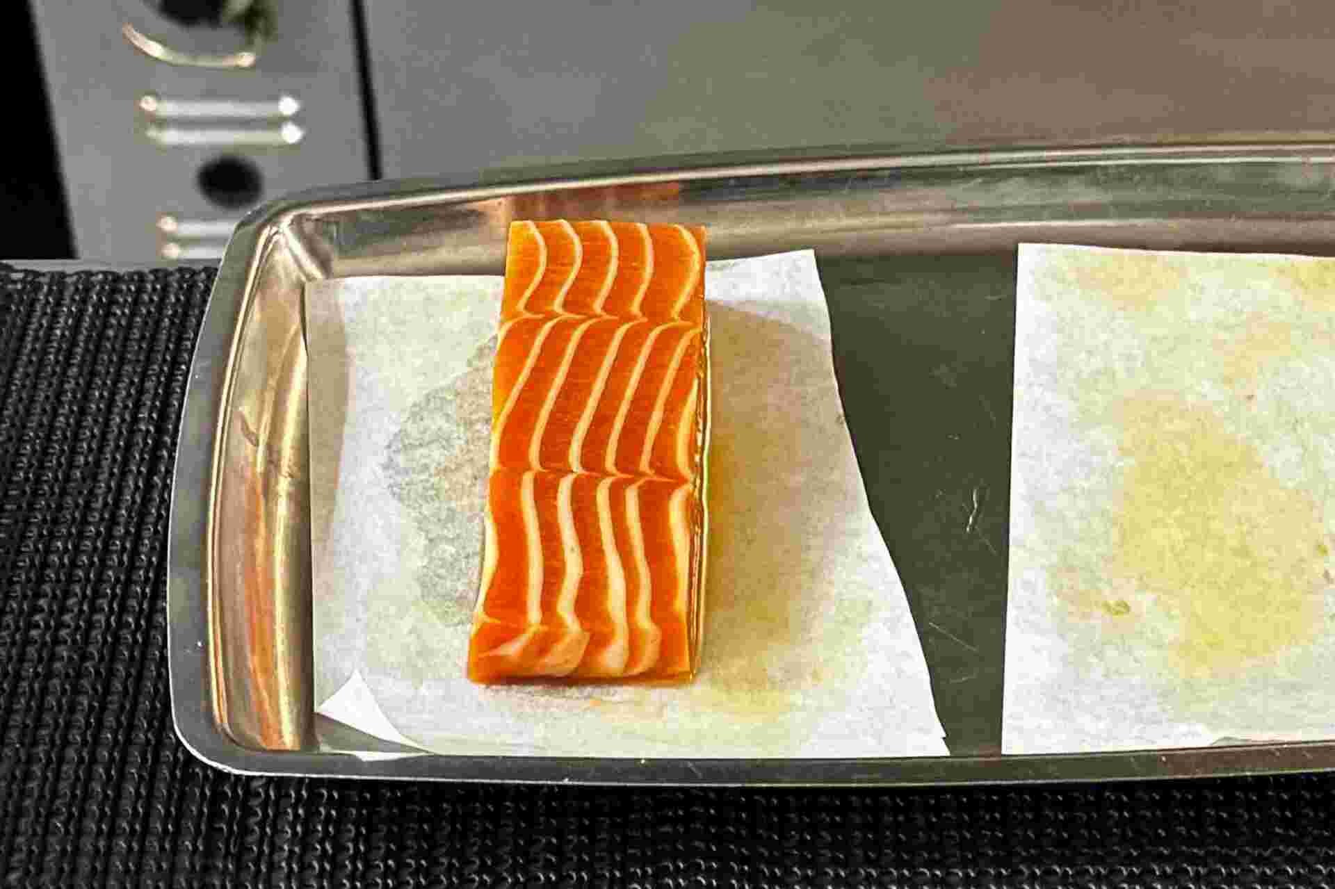 Plant-based Salmon by New School Foods - 31-Raw-vegan-salmon-fillet-on-parchment-paper-in-a-metal-tray-1
