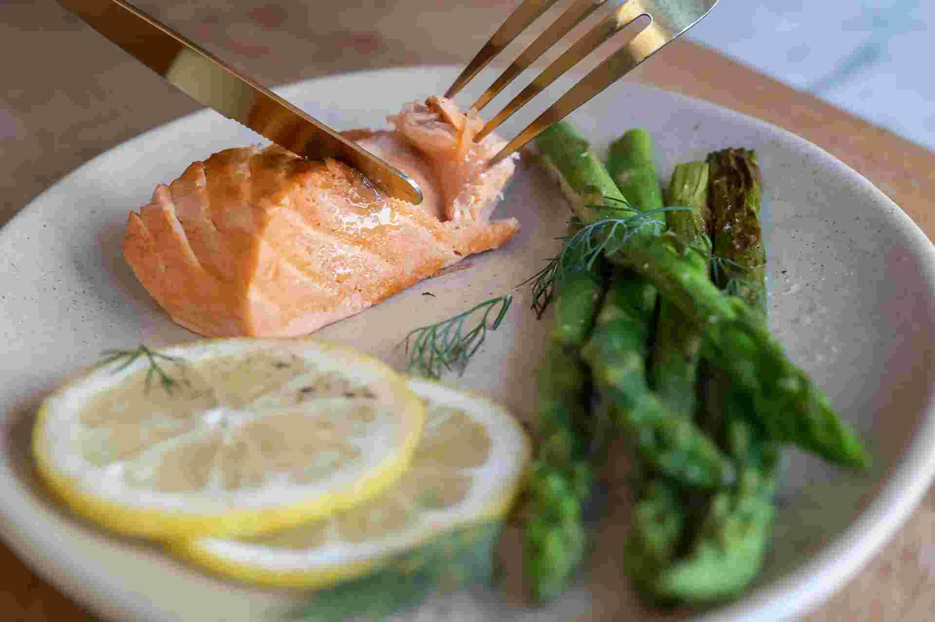 Plant-based Salmon by New School Foods - 33-Fork-cutting-salmon-with-asparagus-garnish